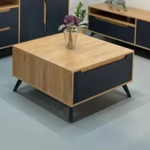 Square wood-look storage coffee table with dark drawer and angled black legs in a modern living room