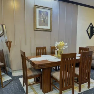 Wooden 6 seater dining set with rectangular table, sculptural pedestal base and six padded slatted-back chairs