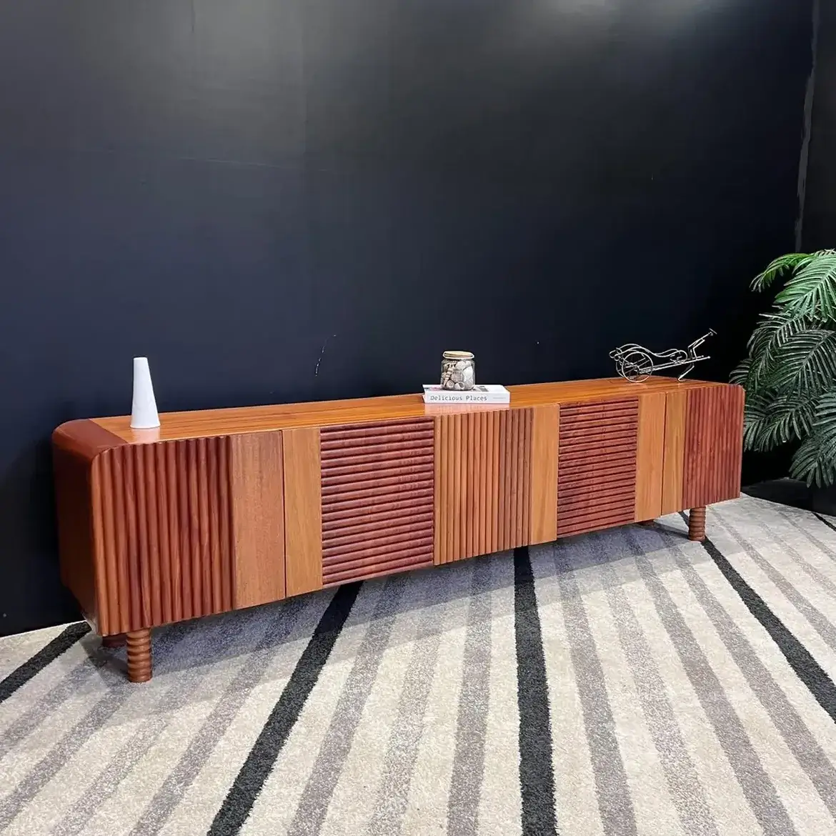 7ft brown fluted TV console with alternating ribbed cabinet fronts and raised feet