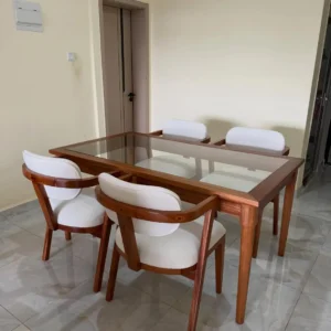 4-seater tempered glass dining set with light upholstered chairs