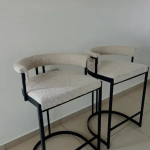 Alderhurst cream upholstered metal bar stool with black frame