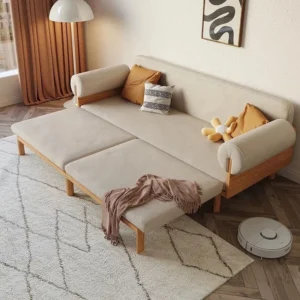 Cream sofa bed opened with two extension sections and exposed wood frame