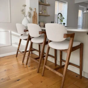 Armitage wooden bar stool with cream upholstered seat and backrest