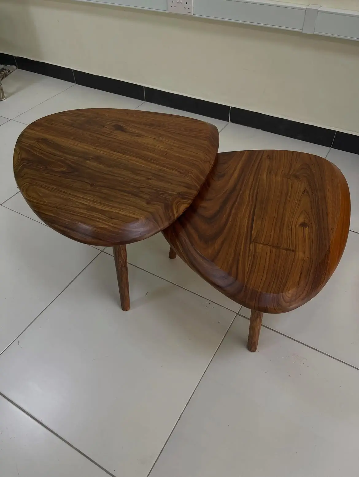 Monsoon Beechridge two-piece wooden nesting coffee table set with rounded brown tops