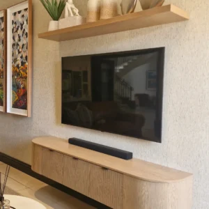 Oak-tone floating TV cabinet with fluted front and rounded ends