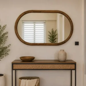 Rattan console table with horizontally mounted oval wood-frame mirror