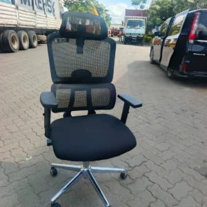 Black high-back mesh office chair with headrest and lumbar support
