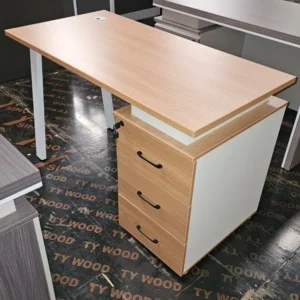 Compact light wood-look office desk with three-drawer pedestal