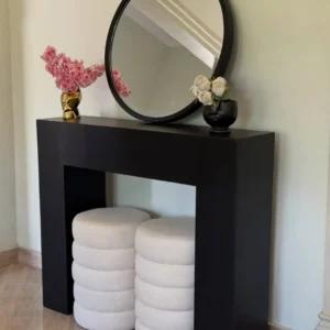 Black console set with round mirror and two upholstered stools in Kenya