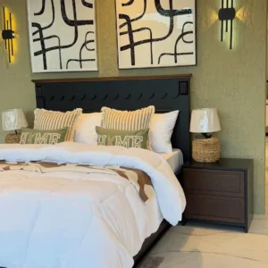 Black mahogany bed frame with scalloped headboard detail in Nairobi