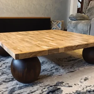 Brown square mahogany coffee table with patterned top and rounded legs