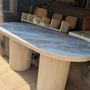 Cream dual fluted pedestal dining table with pale marble-look top