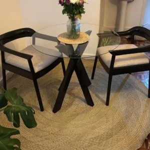 Cream 2 seater tempered glass dining set with dark sculptural base in Nairobi