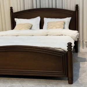 Dark brown 5×6 wooden bed with curved headboard and turned posts