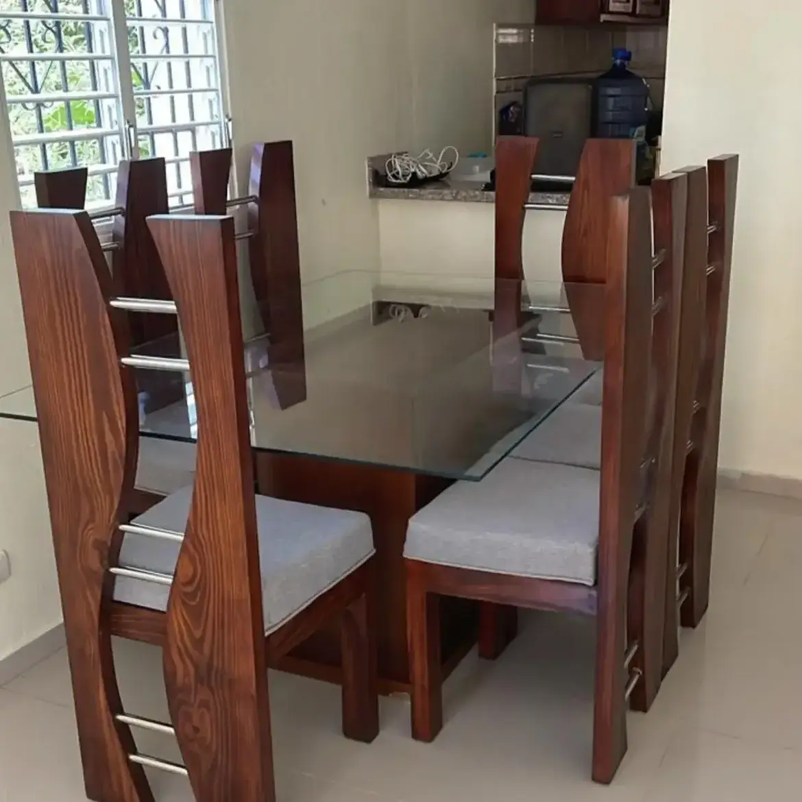6 seater glass dining set with high-back grey chairs in Kenya