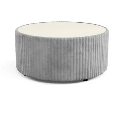 Grey upholstered round coffee table with sand-coloured top