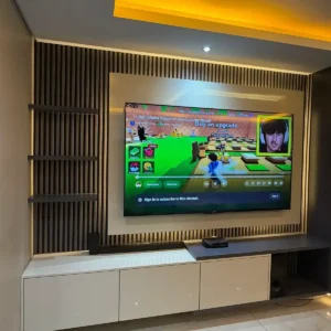Light floating console TV wall with vertical slats and LED lighting