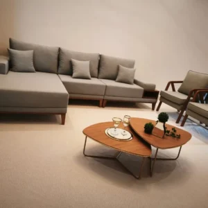 Light grey sofa set with extended chaise and matching wood-frame lounge chairs