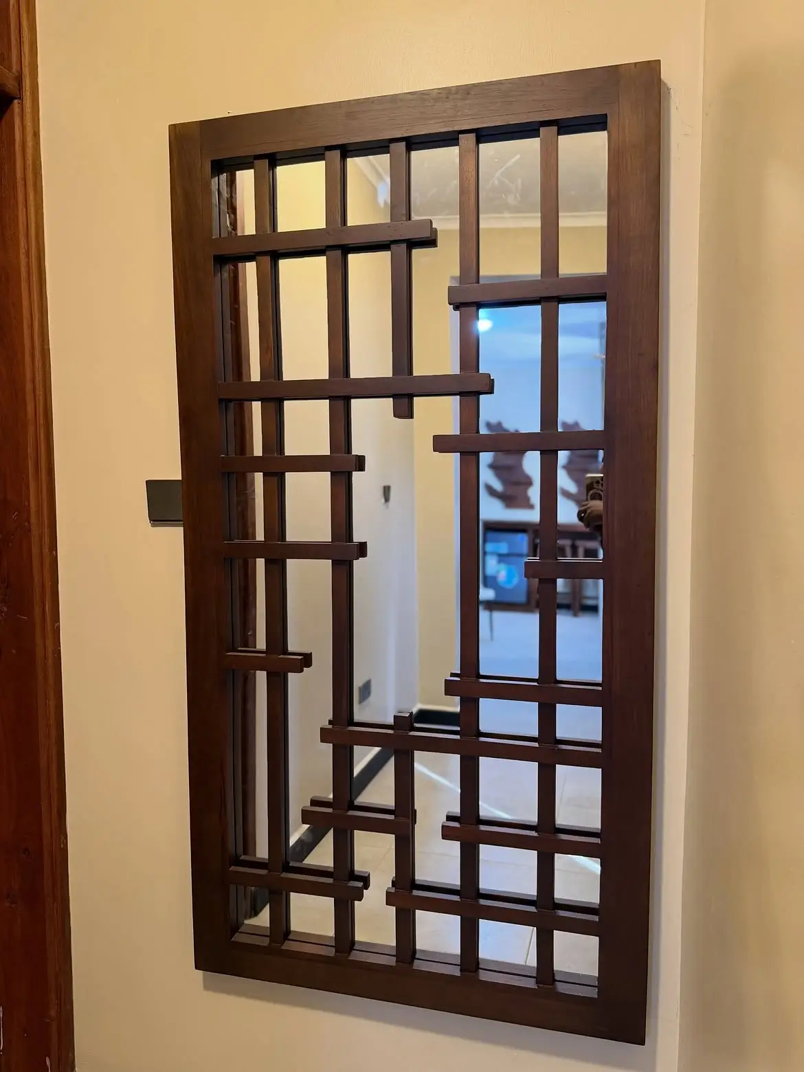 Mahogany engraved wall mirror with geometric wood overlay