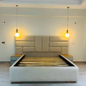 Mahogany 6×6 upholstered bed with geometric padded-panel headboard