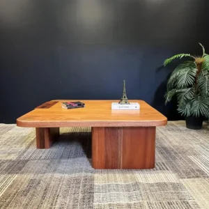 Mahogany office desk with broad rectangular wood top and pedestal-style supports