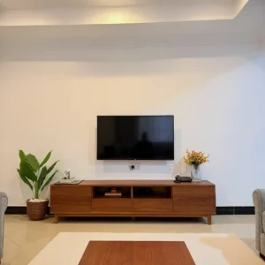 Mahogany TV stand with open centre compartments and closed storage