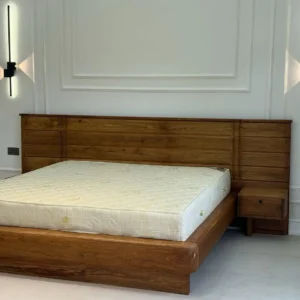 Mahogany wood panel bed with wide headboard and bedside units in Kenya