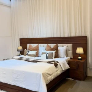 Mahogany 6×6 wooden bed with wide tufted-panel headboard