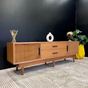Meru Oak 6ft TV console with ribbed cabinet fronts, two central drawers, dark handles and raised legs