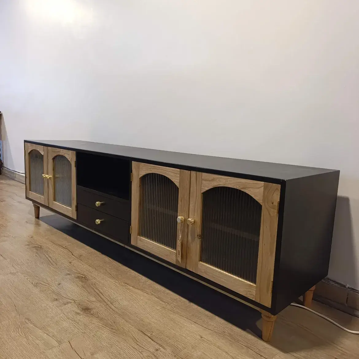 Meru Oak and black TV stand with fluted glass doors and two drawers