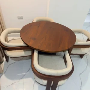 Mninga 4 seater dining set with brown rounded table and four cream upholstered armchairs in Kenya