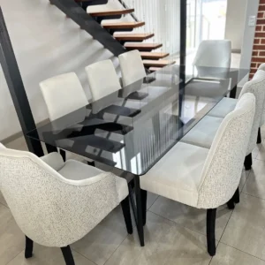 8 seater tempered glass dining set with light upholstered chairs in Kenya