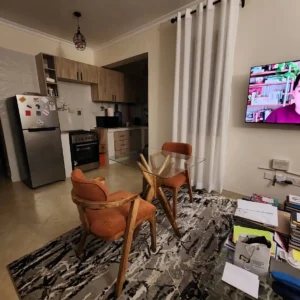 2 seater glass dining set with rust upholstered chairs in Kenya