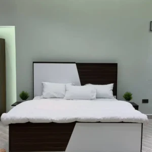 5×6 two-tone bed with brown and white geometric headboard