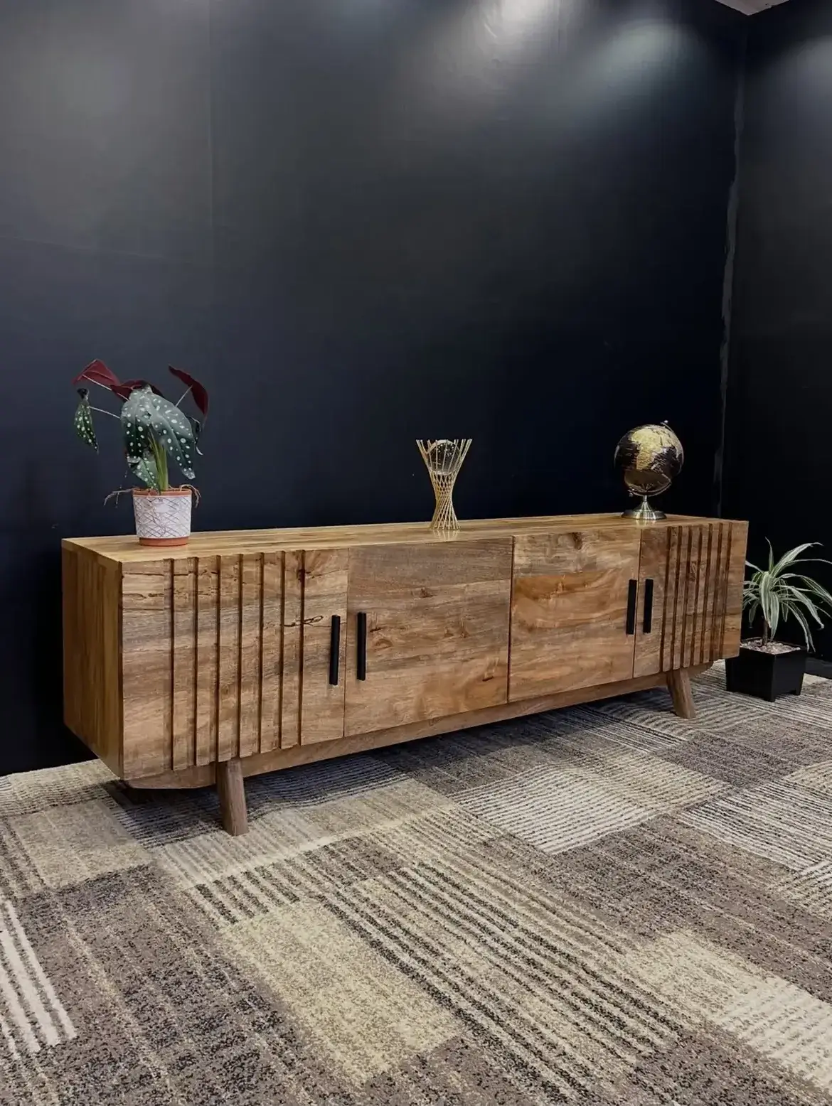 Walnut-tone four-door sideboard cabinet with black handles, slatted outer fronts and raised legs