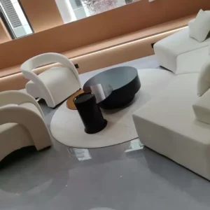 White couch and two matching curved lounge chairs in a modern living room