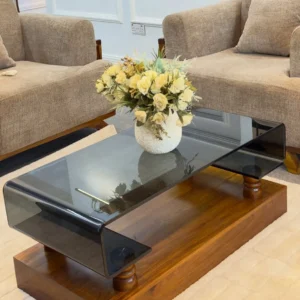 Mninga wood coffee table with curved dark Turkish glass top