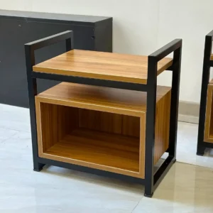 Brown and black bedside table with a flat upper surface and open rectangular lower storage cubby