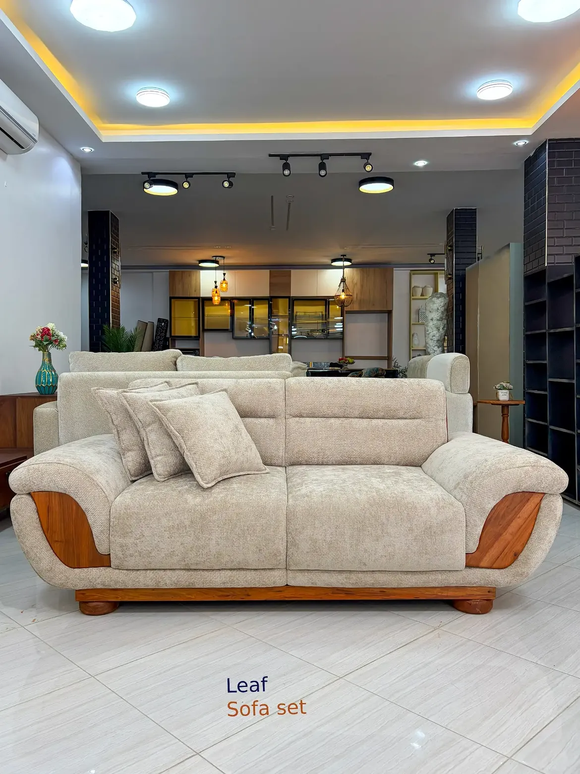 Beige Leaf sofa with curved wooden-look arm inserts and rounded upholstered arms