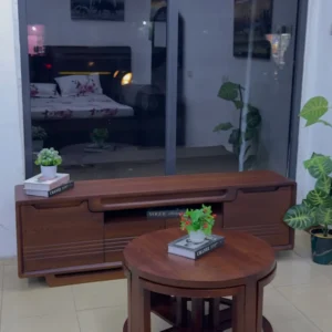 Monsoon Aldermere brown TV stand and matching round coffee table set with curved cabinet detailing and open geometric table base.