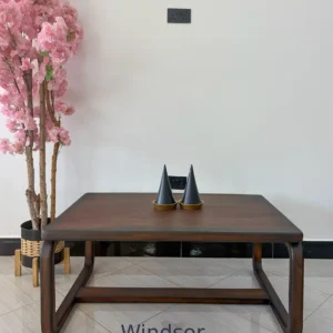 Dark brown rectangular coffee table with rounded corners and curved loop-shaped supporting frames
