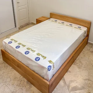 Monsoon Alderhurst 5×6 mahogany bed with natural brown wood finish and rectangular headboard