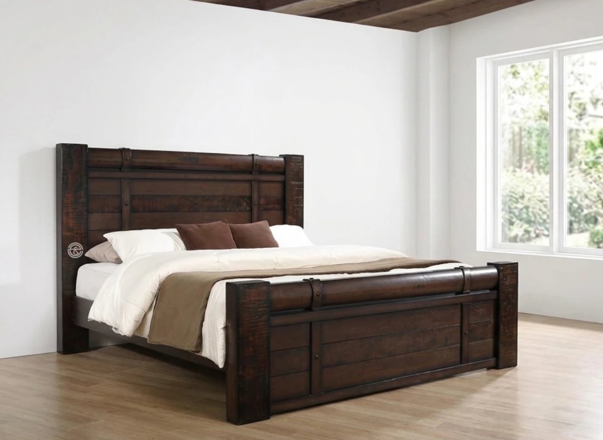 Monsoon Bayridge 6×6 dark rustic-brown wooden bed with rounded horizontal headboard rail, substantial square posts and matching raised footboard.