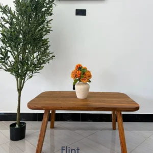 Natural brown wooden coffee table with rounded rectangular top and four outward-angled legs