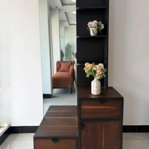 Dark brown dressing table with tall rectangular mirror, black side shelves, drawers and lower cabinet