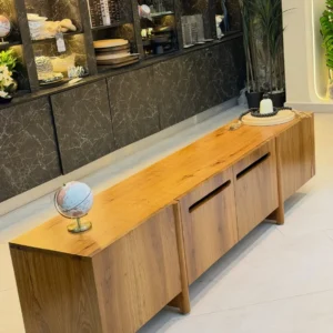 Monsoon Birchleigh 7-foot Mninga TV stand with natural varnish finish, honey-brown wood grain, recessed handles and low supporting legs.