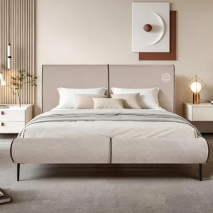 Monsoon Briarfield 6×6 beige upholstered bed with two-panel padded headboard, rounded matching footboard and slim dark legs.
