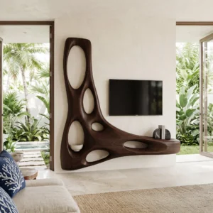 Dark brown sculptural TV wall unit with tall asymmetrical frame, large oval openings and curved horizontal extension beside a wall-mounted television.