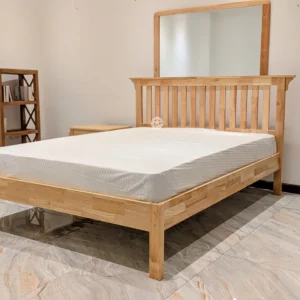 Monsoon Clovervale 5×6 natural wooden bed with vertical slatted headboard, raised frame, rectangular footboard and four wooden legs.