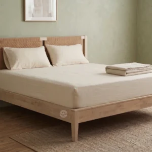 Monsoon Crestfield 6×6 light natural wooden bed with two woven-look headboard panels, straight side rails, low footboard and tapered legs.